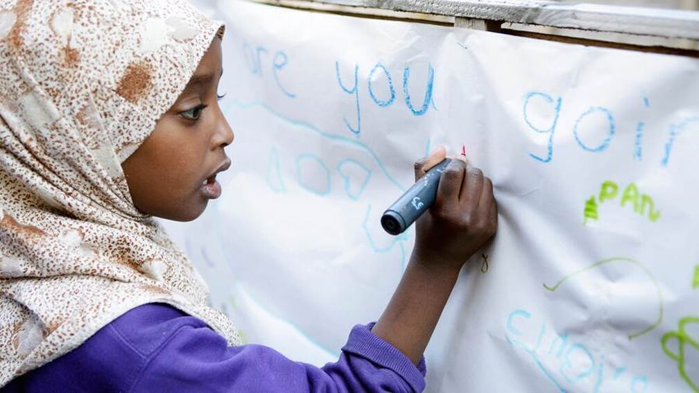 Child taking part in Everybody Writes