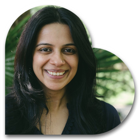 Image of Rashimi smiling in a heart shape.