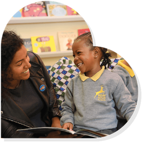 Nadia Shireen at a school visit within a heart shape.