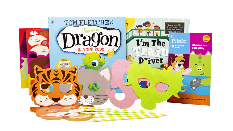 The contents of pack 5, including some animal masks and books.