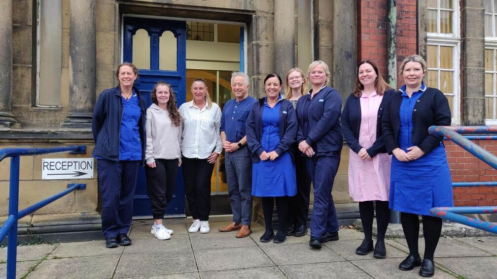 Frank Cottrell-Boyce with health visitors in Newcastle