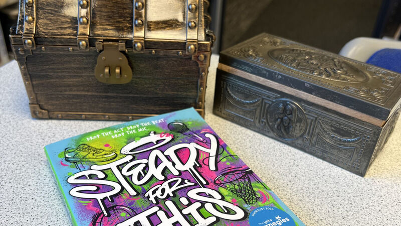 The book Steady For This in Lucas's school library with two treasure chests