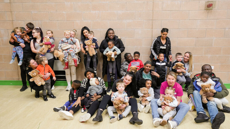 A photo of families at The Beeches Day Nursery with their Build-A-Bears