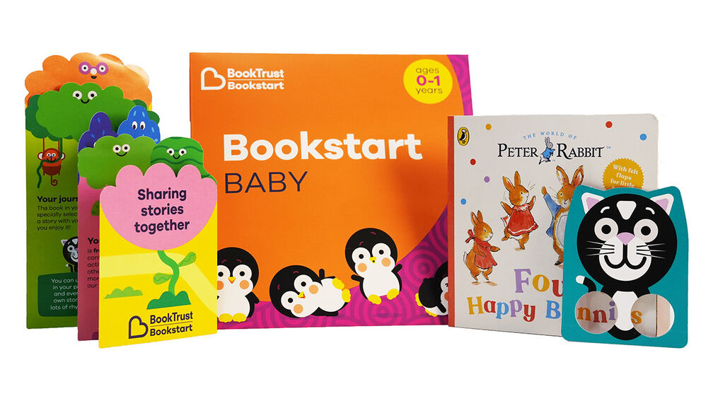 The Bookstart Baby pack including a guide for parents, a cat finger puppet, and a copy of Peter Rabbit: Four Happy Bunnies