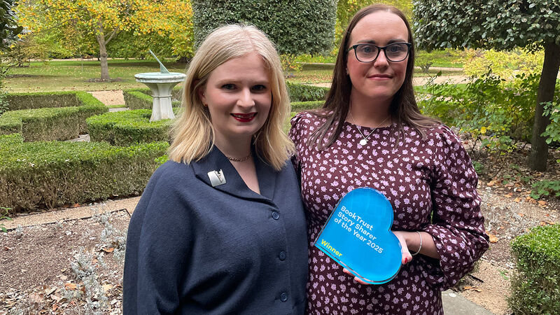 Kathryn Anderson, BookTrust's Senior Partnerships Manager for Northern Ireland, standing with Story Sharer of the Year Award winner Angela McCabe - who is holding her award