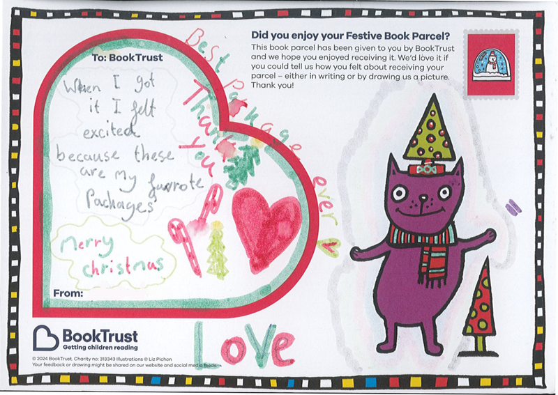 A postcard with a child's handwriting, saying "When I got it I felt so excited because these are my favourite packages" and a drawing of a heart shape.