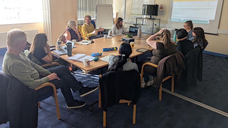 Dr Mike Merriman, BookTrust staff and other stakeholders discussing Reading Rights plans in Knowsley