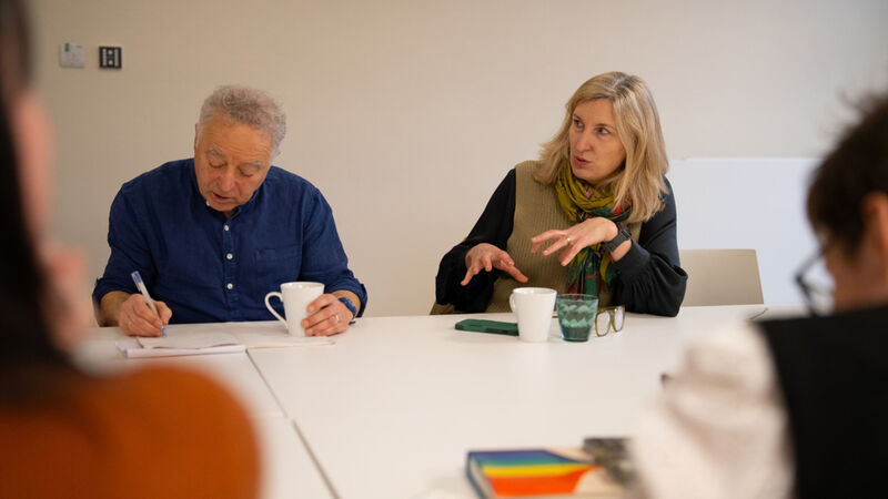 Waterstones Children's Laureate Frank Cottrell-Boyce sitting with Anna Hartley during a Reading Rights meeting