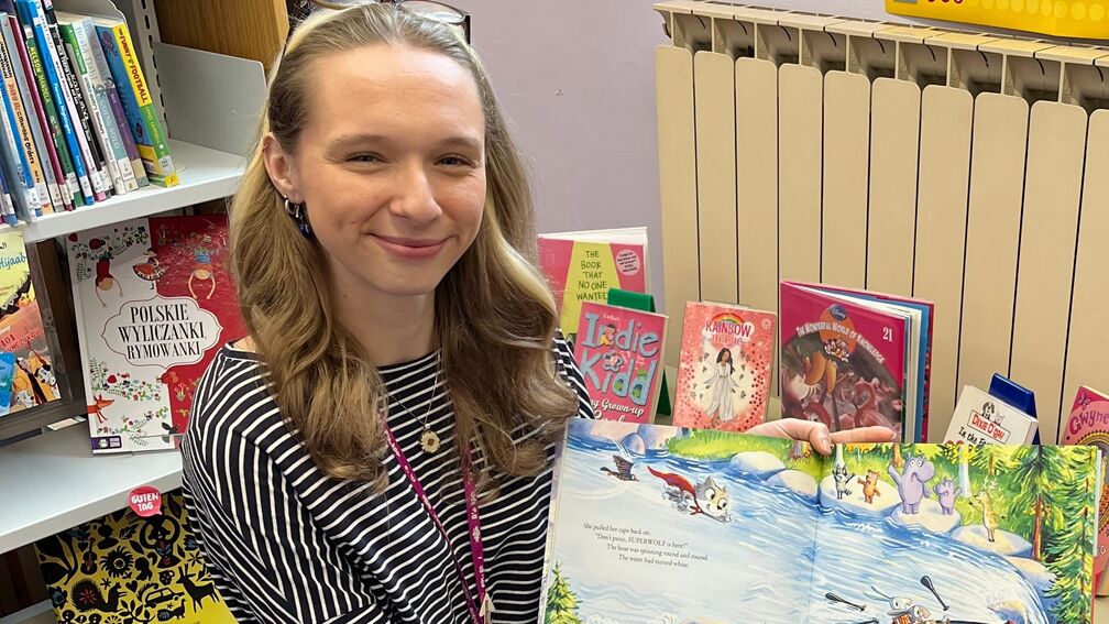 Librarian holding BookTrust Storytime books