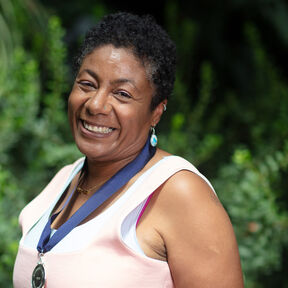 Patrice Lawrence wearing her Children's Laureate medal and smiling