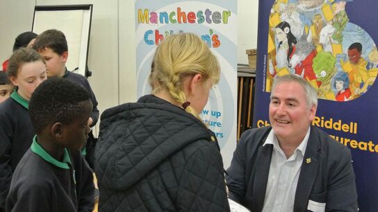 The author Chris Riddell meeting children on a school visit
