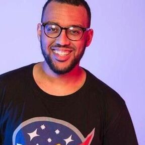 A photo of Benjamin Dean looking to camera and smiling.