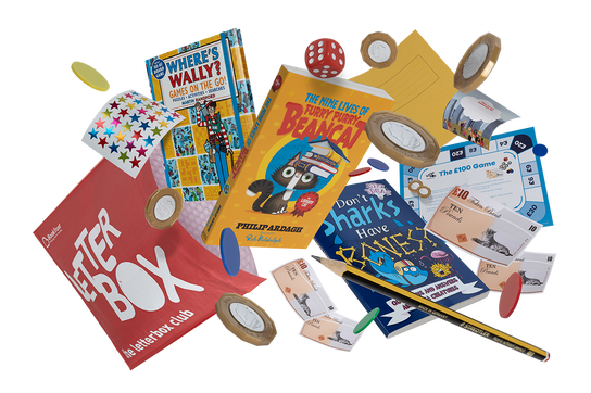 An image showing a selection of books, toys and stickers, coming out of a red Letterbox Club parcel.