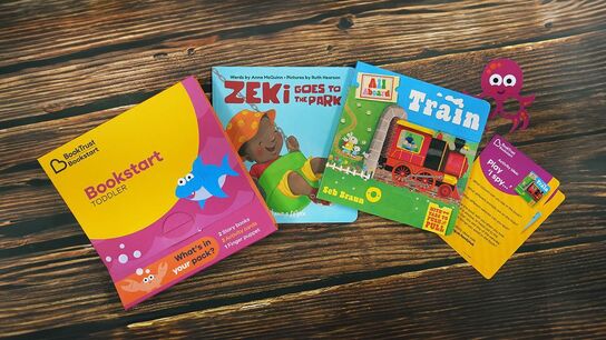 The Bookstart toddler pack laid out on a table.