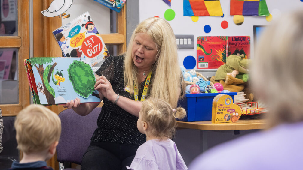 A woman reading to children